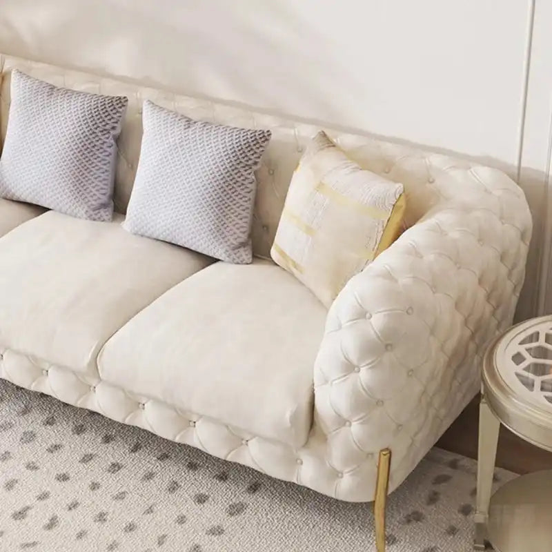 Comfortable cushion sofa leather modern luxury romantic sofas with tufted design and gold legs, ideal for relaxing in living rooms or children’s spaces.