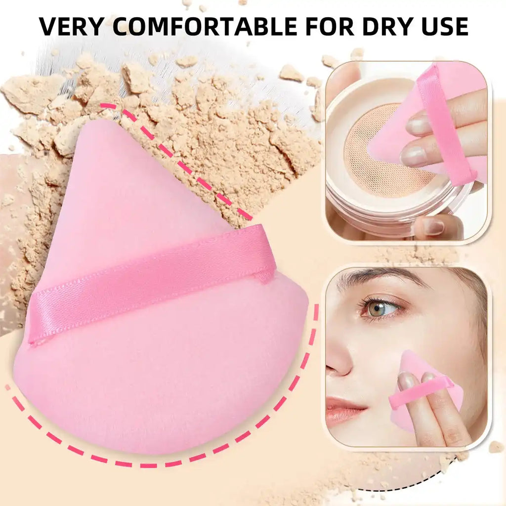 Close-up of pink triangular powder puff from the 25-piece makeup tool set, showing comfortable dry use on face with hand strap.