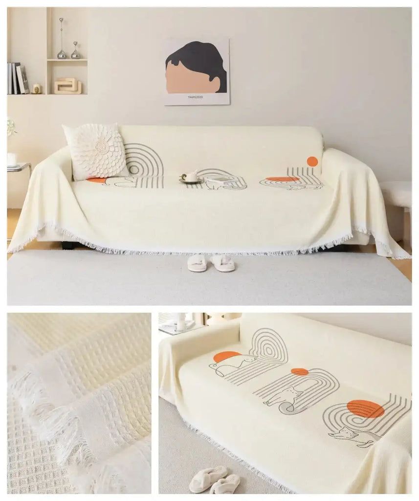 Cream sofa towel cover with abstract orange and gray pattern, non-slip and washable with tassel trim, perfect for modern home decor.