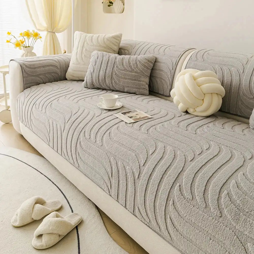 Gray plush sofa cushion protector on a contemporary couch