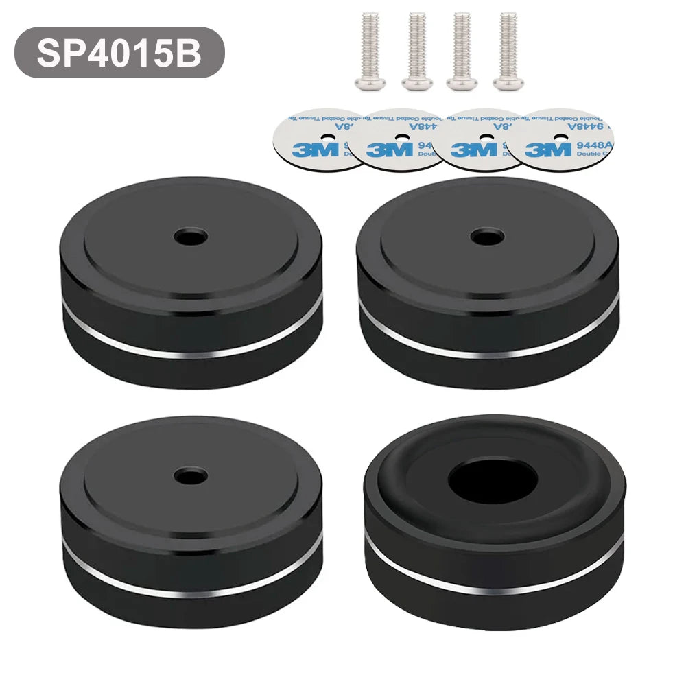 Set of four black aluminum speaker shoes SP4015B with non-slip rubber rings and 3M adhesive pads, ideal for audio equipment vibration isolation.
