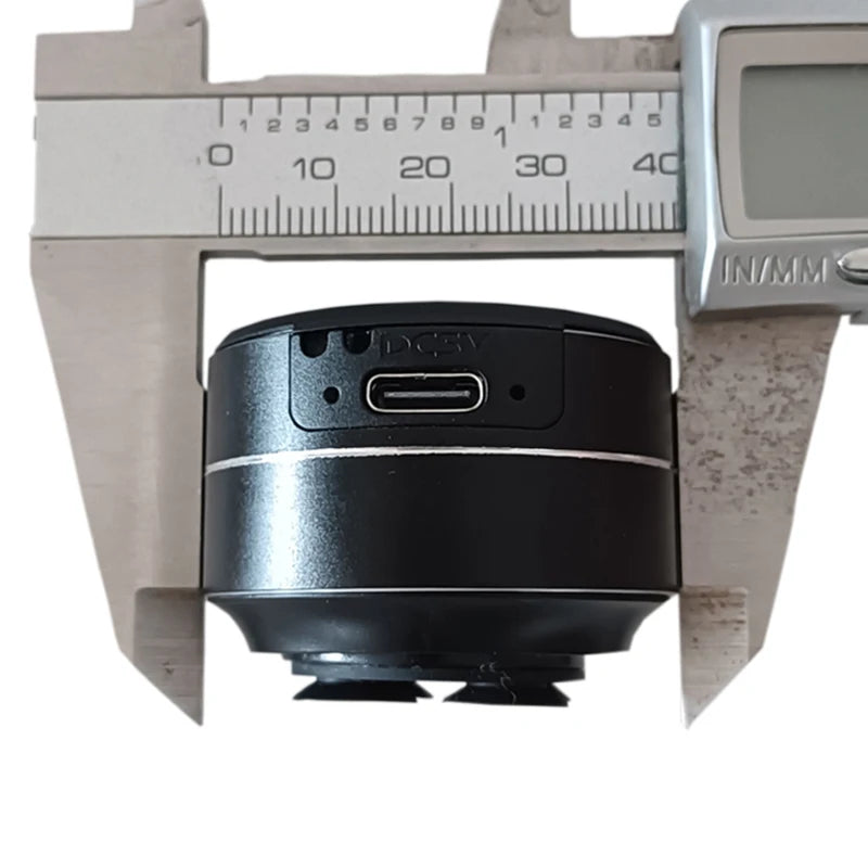 Bone conduction wireless speaker with sucker mount and USB-C port shown in digital caliper for size reference, TWS hi-fi sound enhanced bass.