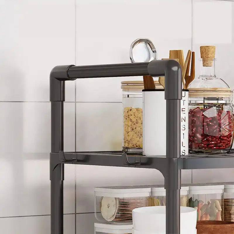 Top section of kitchen storage rack with jars and utensils, highlighting sturdy frame and multi-layered shelf for organized kitchen use.