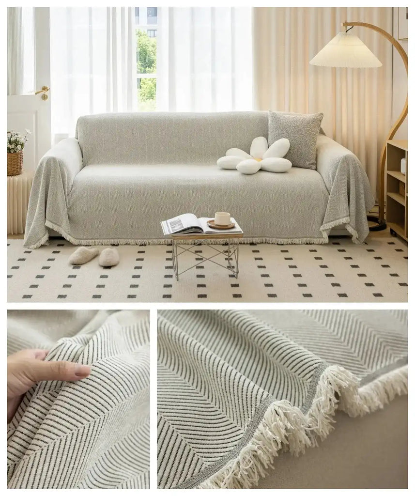 Beige breathable sofa towel cover with subtle stripe design and tassel edge, fits various sofa types for stylish home decoration.