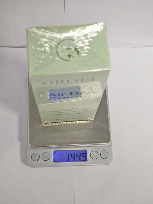 Hair styling cream box on digital scale