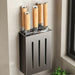 Wall-mounted knife storage box with wooden-handled knives in kitchen