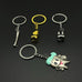 Four dentist charm keychains arranged on black background, showcasing a mix of cartoon tooth and realistic dental tool designs.