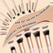 25 Professional Makeup Tools Set with pink brushes, sponges, powder puffs, eyebrow trimmer, and storage bag