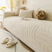 Cozy cream plush sofa cushion protector on a modern sofa