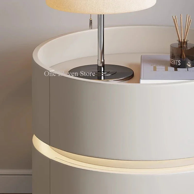 Modern bedroom nightstand with built-in LED lighting and a table lamp