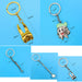 Detailed measurements of five dentist-themed keychains including cartoon tooth, dental mirror, and molar charms in gold and silver.