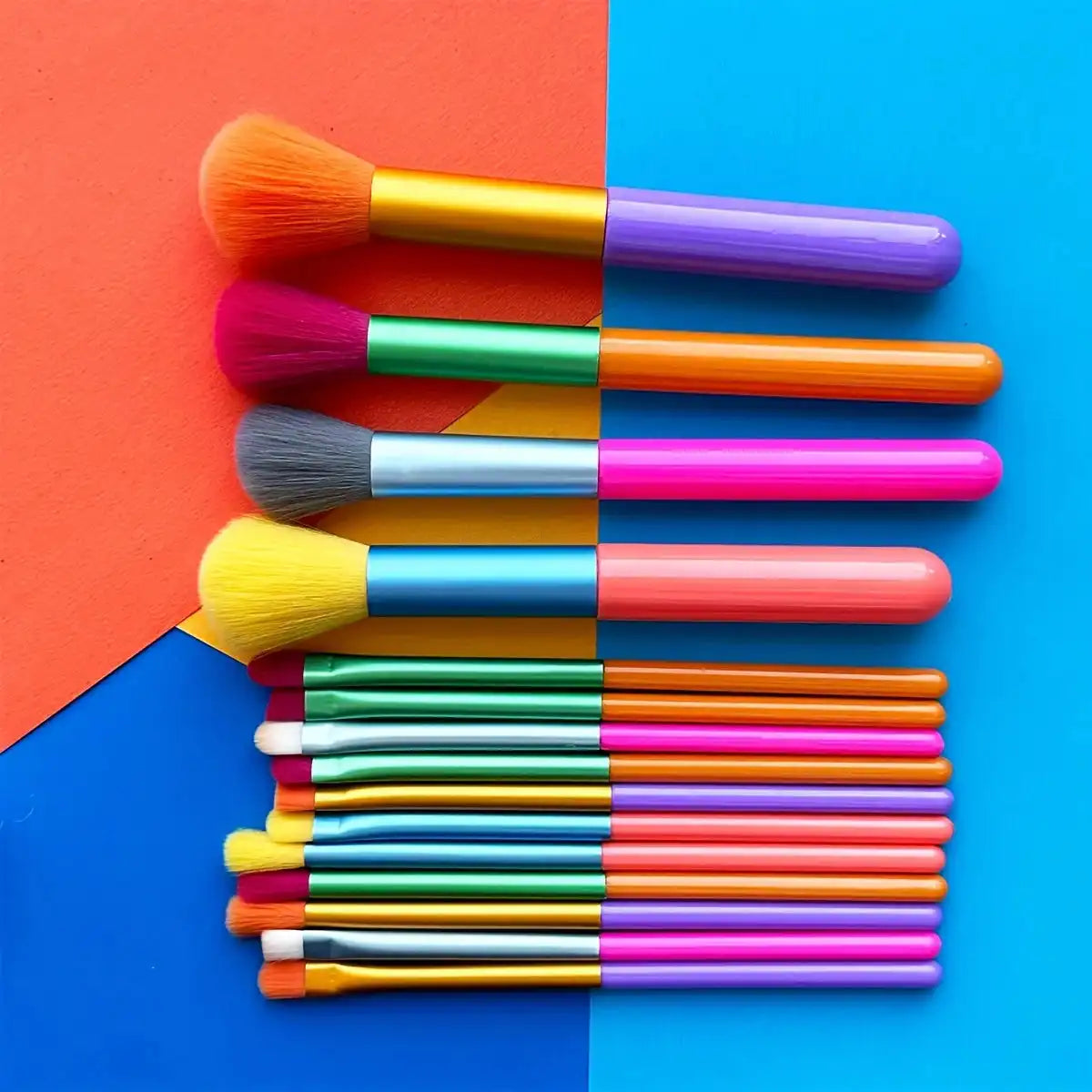 Full 15-piece Colourful Makeup Brush Kit laid out on a multicolor background, showcasing brushes for foundation, contour, and eye shadow blending.