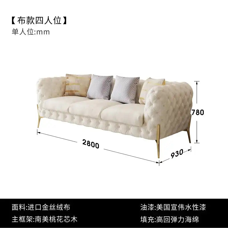 Modern Luxury Leather Sofa with tufted design, gold legs, and plush pillows